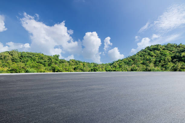 istock Road and green mountain background 1822092853