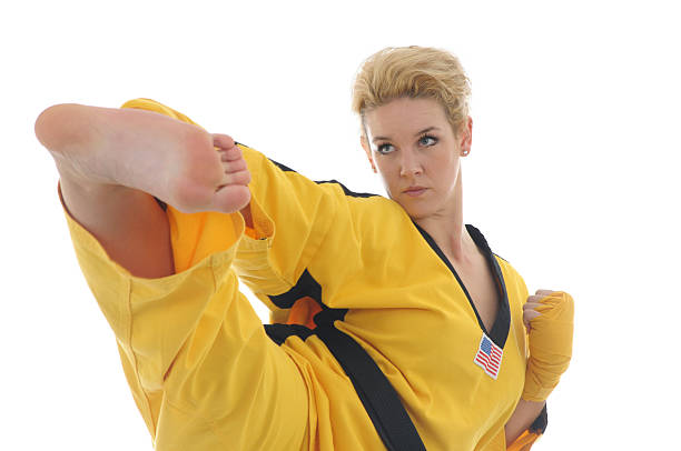 fighting technik - karate women kickboxing human foot stock-fotos und bilder