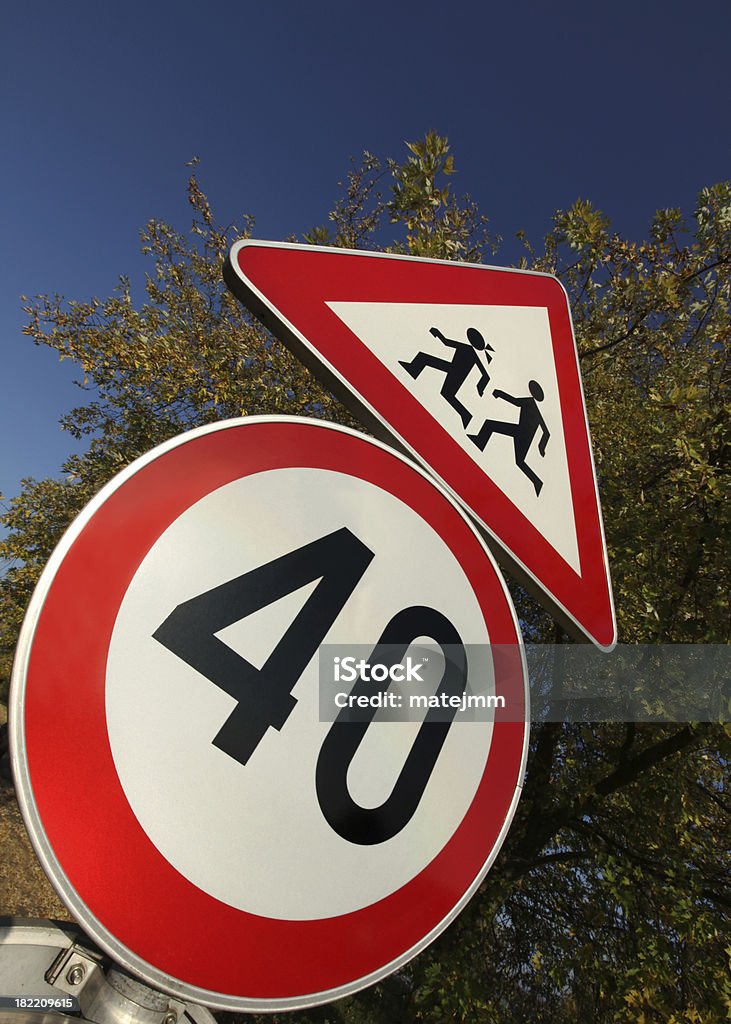 Road to School Traffic signs on road to school. Speed limit and kids on the road. Autumn Stock Photo