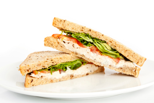 Delicious chicken salad sandwich with mayonnaise on a plate.