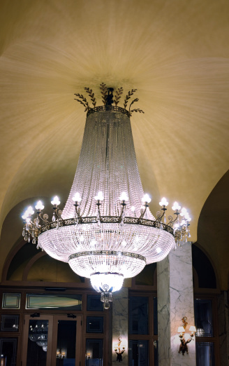 huge antique crystal chandelier lamp in the lobby