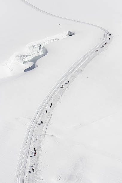 istock View from above showing walkers hiking around crevasse 182210069