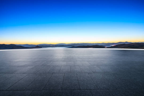 istock Empty square floor and mountain with blue sky at sunrise 1822101015