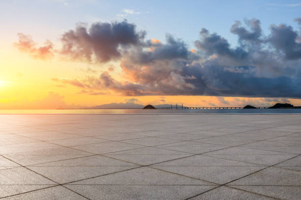 istock Empty square floor and coastline with sky clouds at sunrise 1822101018