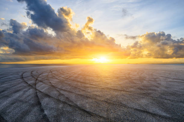 istock Asphalt road and coastline with sky clouds at sunset 1822101560