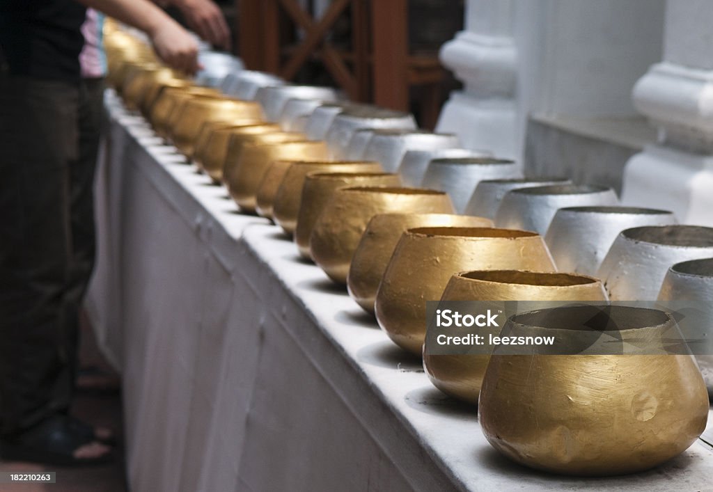 Offering Bowls in Thailand Gold and silver religious offering bowls at a temple in Thailand.See a lightbox of all my shots of Bangkok: Begging Bowl Stock Photo