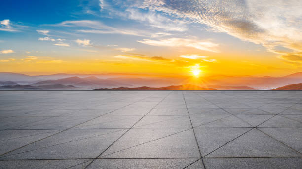 istock Empty square floors and mountain with colorful sky clouds at sunrise 1822103152