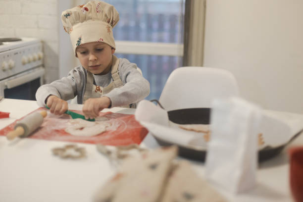 istock Child making Christmas cookies 1822103683