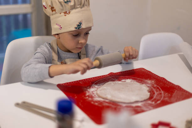 istock Child making Christmas cookies 1822103686