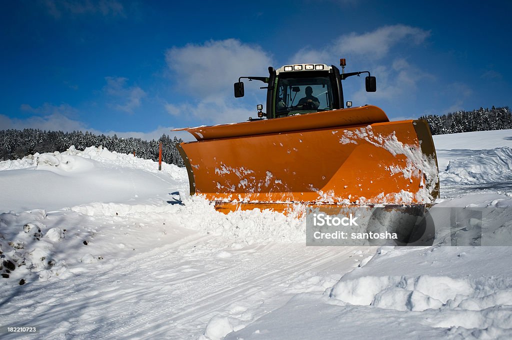 Snowplow Machine removing snow off mountain road Winterdienst Stock Photo