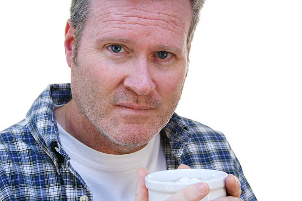 istock Man Holding A Cup Of Hot Cocoa 182211212