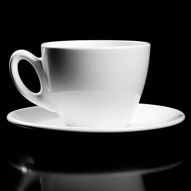 istock Porcelain cup isolated on black 182211725