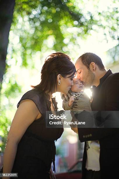 Young Hispanic Family In Urban Park Stock Photo - Download Image Now - 0-11 Months, 20-29 Years, Adult