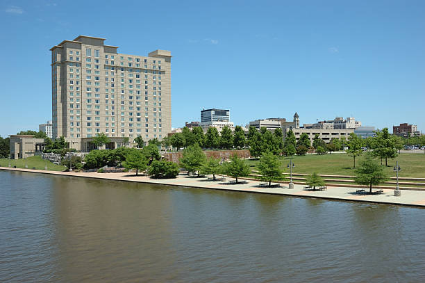 Downtown Wichita and the River Walk "A shot of downtown Wichita, Kansas, including part of the River Walk, Wichita's $130 million redevelopment project along the eastern bank of the Arkansas River." wichita photos stock pictures, royalty-free photos & images
