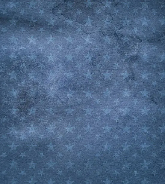 Photo of dark blue stained paper with stars