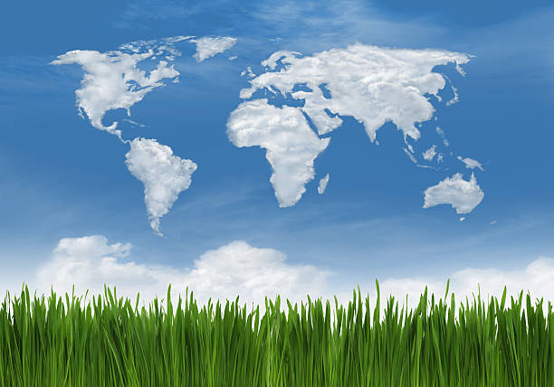 Green grass and clouds in the shape of world map background.