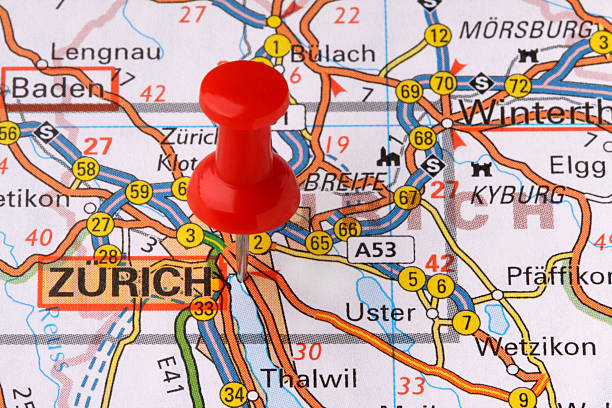 Zurich on a map. "A red pushpin on a map pointing to Zurich, Switzerland." zurich map stock pictures, royalty-free photos & images