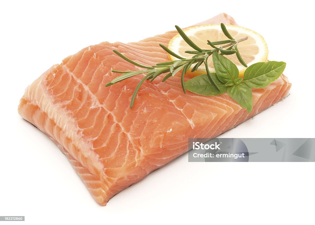 Salmon fillet isolated on white with lemon and herbs Salmon fillet isolated on white with lemon and herbs.My other similar images Salmon - Seafood Stock Photo