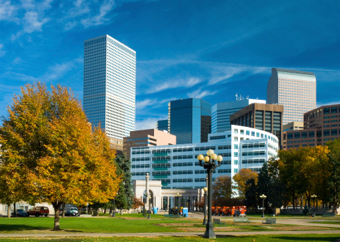 Denver Downtown skyline with Civic Center Park in the foreground.