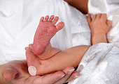 Newborn baby heal prick with bandaid