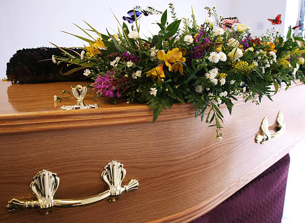 Coffin decorated with flowers stock photo