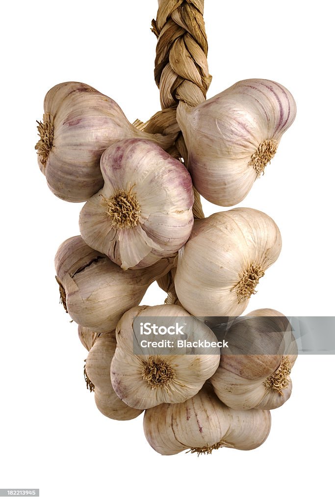 Braid of garlic bulbs on white background Braided Stock Photo