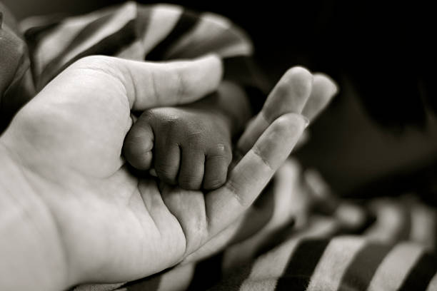 istock Newborn Baby's Fist 182214645