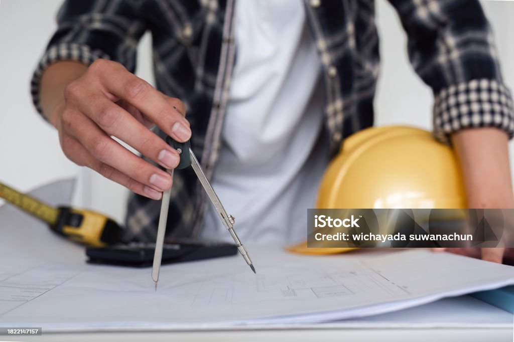 Engineer Planning Paper Young Asian Engineer Drawing Construction Project Plans On Plan Paper ...
