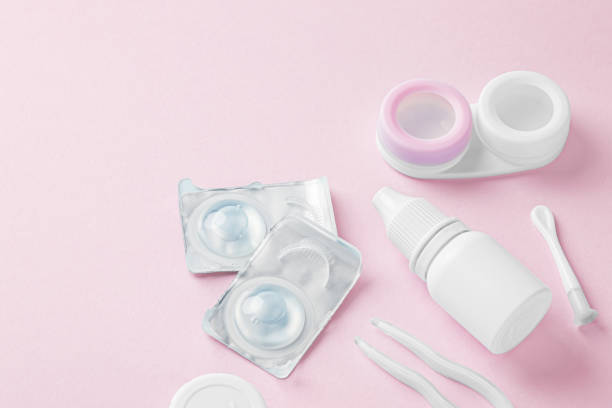 istock Contact lenses with container, eye drop and accessories on pink background 1822147162