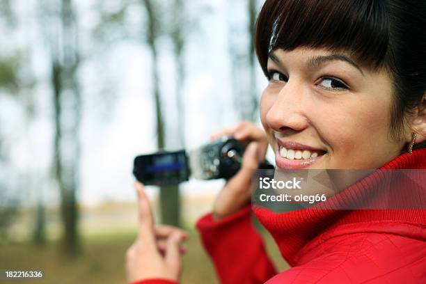 Woman With A Digital Video Camera Stock Photo - Download Image Now - Adult, Cheerful, Clothing