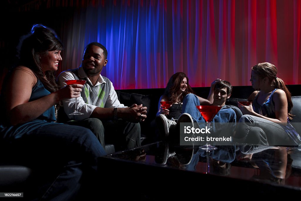 Bar and fun "Group of 5 hanging out at the bar with some cocktailsShot at inhauslypse, Nashville - October 2009" Cocktail Stock Photo