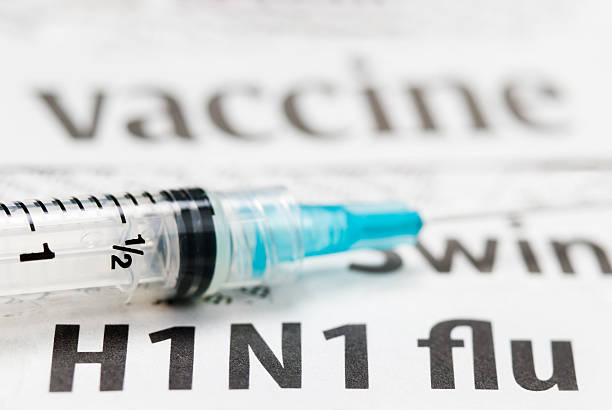 istock H1N1 Flu Shot, Vaccination headlines (cyan syringe) - VI 182216789
