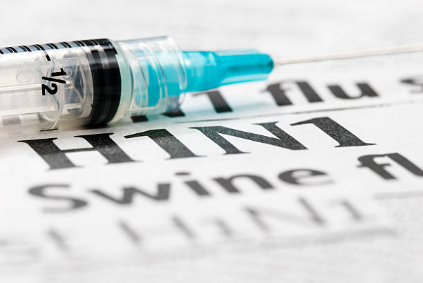 istock H1N1 Flu Shot, Vaccination headlines (cyan syringe) - VIII 182216799