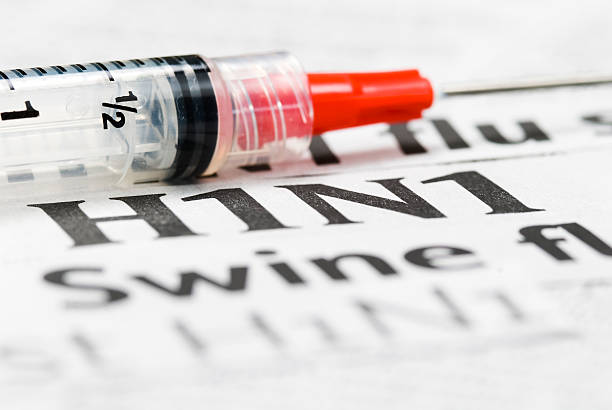 istock H1N1 Flu Shot, Vaccination headlines (red syringe) - IX 182217362