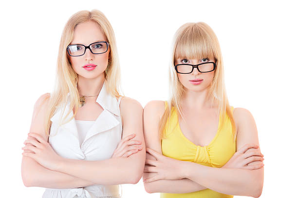 istock Two beautiful young serious women in glasses 182217869
