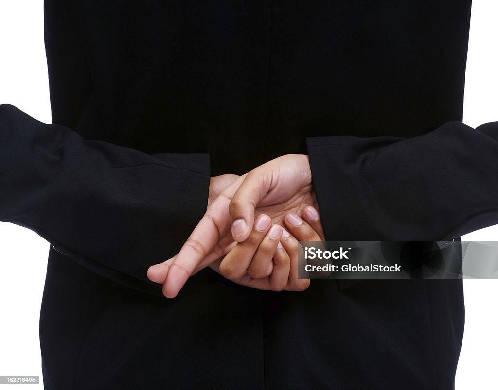 中央のビジネスウーマンの指をクロス - 後ろ姿のロイヤリティフリーストックフォト