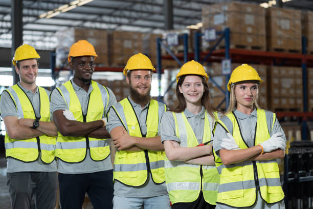 istock Warehouse and teamwork concept. Group of warehouse worker standing with crossed arms at warehouse 1822188720