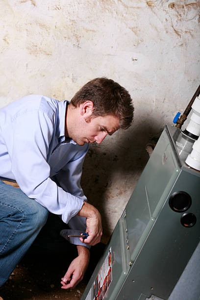 istock Service Man Working on Furnace 182218930