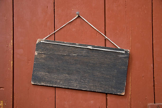 istock Blank wooden sign hanging on wood 182219113