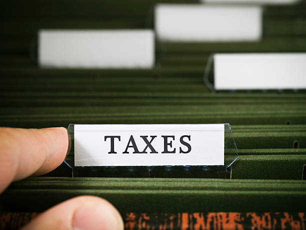 istock Tax file in a filing cabinet 182219352