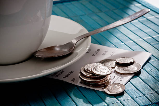 istock A tip of coins left at a coffee shop. 182219371