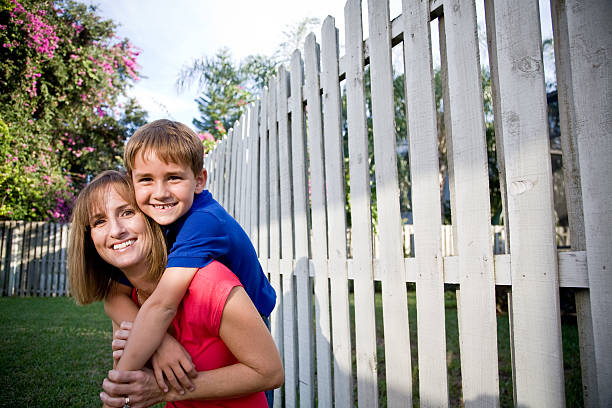 istock Mom and son piggyback 182219511