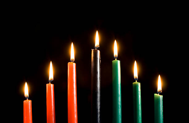Kwanzaa Candles Only Medium shot of Kwanzaa candles lit against a black background with room for text. medium shot stock pictures, royalty-free photos & images