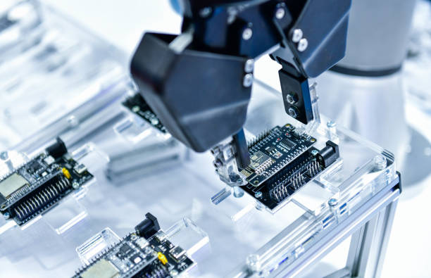 istock Modern Robot Arm automation system moving circuit boards in a factory 1822207078