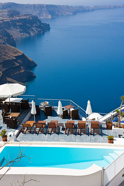 istock swimmingpool sunbeds and umbrellas 182221614