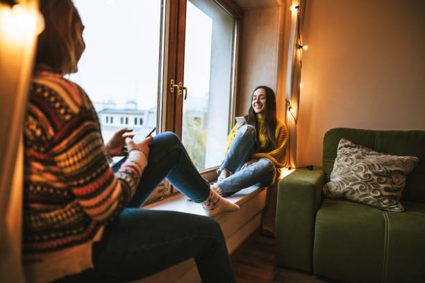 istock friends talking together at home using the tablet 1822217653