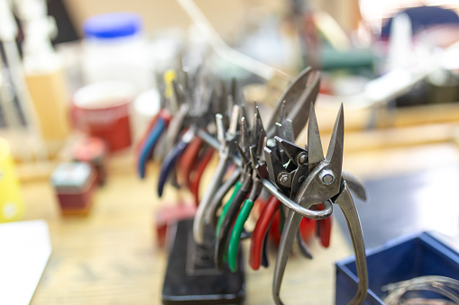 Inside jewelry designer atelier. There are different tools that the designer uses to make jewelry.