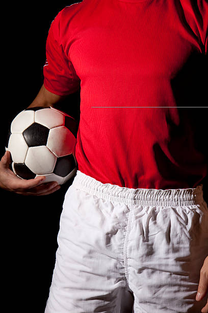 istock Player holding soccer ball 182222771