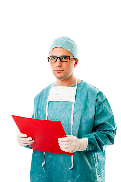 istock Male Surgeon Standing with Medical Folder, Studio Portrait 182223019