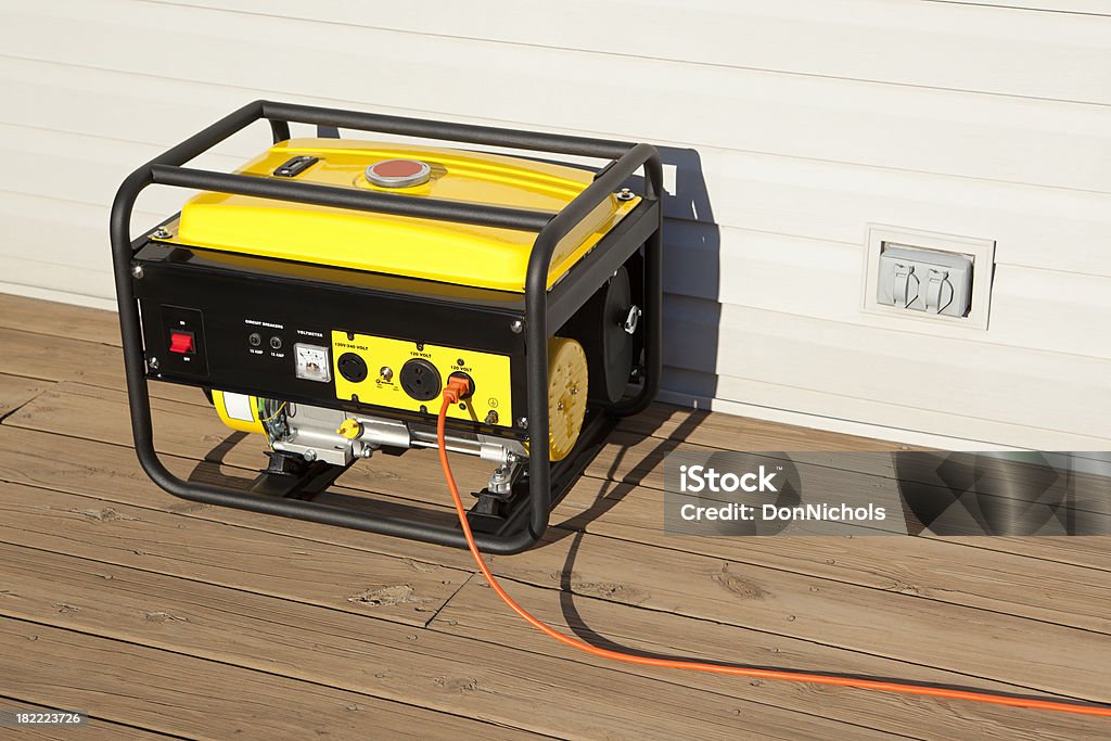 Portable Electric Generator "Extension cord plugged into a gasoline powered, 4000 watt, portable electric generator.Please also see;" Generator Stock Photo